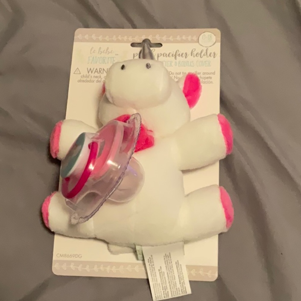Stuffed animal and pacifier